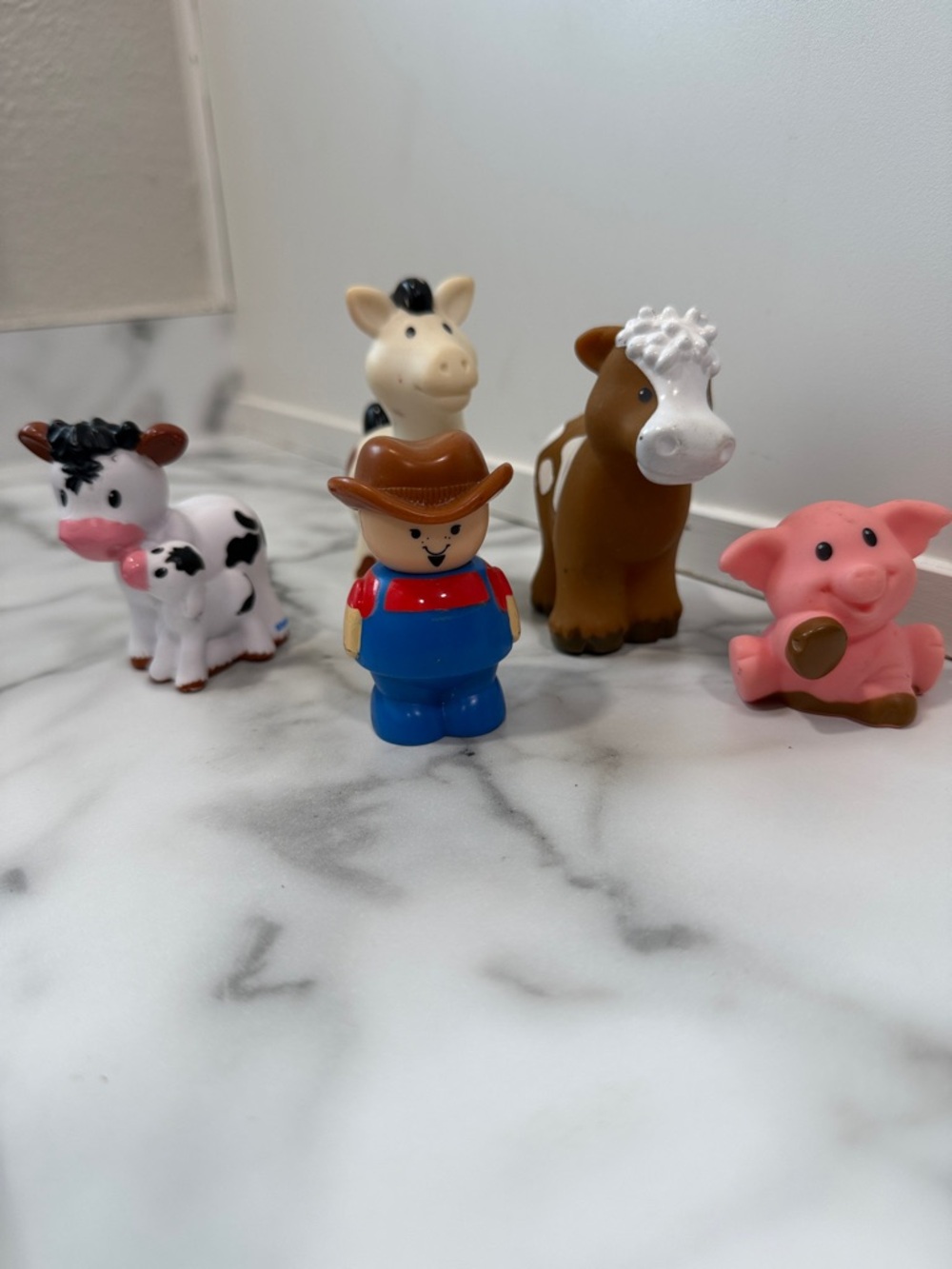 vintage 1990s Shelcore plastic farmer toy figure with Little People farm animals